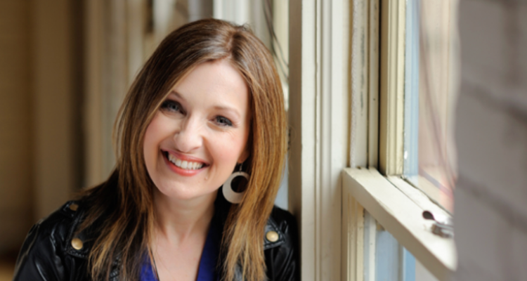 Woman-smiling-by-window
