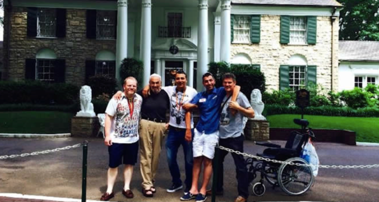 men-standing-one-with-als-in-front-of-elvis-mansion